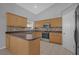 Well-equipped kitchen with ample counter space and wood cabinets at 979 Princeton Dr, Clermont, FL 34711