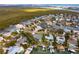 Aerial view showcasing the property's waterfront location and private dock at 100 Via Capri, New Smyrna Beach, FL 32169