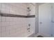 Clean bathroom with white subway tile and bathtub at 100 Via Capri, New Smyrna Beach, FL 32169