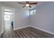 Bedroom with wood-look floors and view of another room at 100 Via Capri, New Smyrna Beach, FL 32169