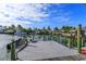 Private boat dock with multiple slips for various watercraft at 100 Via Capri, New Smyrna Beach, FL 32169