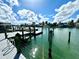 Private boat dock with canal access, perfect for boating enthusiasts at 100 Via Capri, New Smyrna Beach, FL 32169