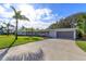 Spacious driveway leading to a newly renovated home at 100 Via Capri, New Smyrna Beach, FL 32169