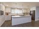 Modern kitchen with white cabinetry, stainless steel appliances, and a large island at 100 Via Capri, New Smyrna Beach, FL 32169