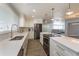 Modern kitchen with stainless steel appliances and island cooktop at 100 Via Capri, New Smyrna Beach, FL 32169