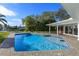 Sparkling pool with patio and waterfront access at 100 Via Capri, New Smyrna Beach, FL 32169