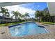 Inviting pool with brick pavers and canal view at 100 Via Capri, New Smyrna Beach, FL 32169