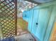 Backyard view of the mobile home with storage shed and lattice at 1005 Oakland St. St, Tavares, FL 32778