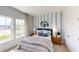 Bedroom with wood-toned furniture and a stylish accent wall at 10093 Pearson Ave, Orlando, FL 32827