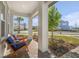 Relaxing front porch with two wooden chairs and a view of the street at 10093 Pearson Ave, Orlando, FL 32827