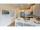 Modern kitchen with white cabinets, stainless steel appliances, and an island at 10093 Pearson Ave, Orlando, FL 32827