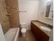 Clean bathroom with granite vanity and tile surround at 1075 S Hiawassee Rd # 911, Orlando, FL 32835