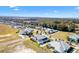 Aerial view of a residential community with houses and landscaping at 1107 Sugar Loaf Key Loop, Lady Lake, FL 32159