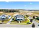 Aerial view of house and surrounding neighborhood at 1107 Sugar Loaf Key Loop, Lady Lake, FL 32159