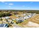 Aerial view of community featuring solar panels and a pool at 1107 Sugar Loaf Key Loop, Lady Lake, FL 32159