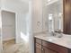 Bathroom with vanity, sink, and shower/tub combo at 1107 Sugar Loaf Key Loop, Lady Lake, FL 32159