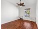 Bright bedroom with hardwood floors and ceiling fan at 1107 Sugar Loaf Key Loop, Lady Lake, FL 32159