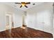 Bright bedroom with hardwood floors and ensuite bathroom at 1107 Sugar Loaf Key Loop, Lady Lake, FL 32159