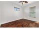 Bright bedroom with hardwood floors and ceiling fan at 1107 Sugar Loaf Key Loop, Lady Lake, FL 32159