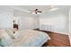 Bright bedroom with hardwood floors and ceiling fan at 1107 Sugar Loaf Key Loop, Lady Lake, FL 32159