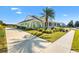 Side view of the house with driveway and landscaping at 1107 Sugar Loaf Key Loop, Lady Lake, FL 32159