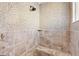 Large walk-in shower with tiled walls and built-in seat at 1107 Sugar Loaf Key Loop, Lady Lake, FL 32159