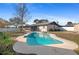 Inviting kidney-shaped pool with a large backyard at 11146 Pine St, Leesburg, FL 34788