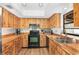 Galley kitchen with stainless steel appliances at 11146 Pine St, Leesburg, FL 34788