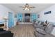 Living room with stone fireplace and built-in shelving at 11146 Pine St, Leesburg, FL 34788