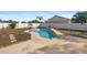 Kidney shaped swimming pool in backyard at 11146 Pine St, Leesburg, FL 34788