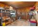 Storage area with wooden walls and shelving at 11146 Pine St, Leesburg, FL 34788