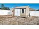 Tan colored storage shed in backyard at 11146 Pine St, Leesburg, FL 34788