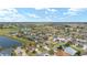 Aerial view of community near golf course and lake at 1149 Eureka Mill Run, The Villages, FL 32162