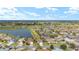 Aerial view of homes near golf course and lake at 1149 Eureka Mill Run, The Villages, FL 32162