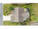 Bird's eye view of a single story house with a large yard and a two-car garage at 1149 Eureka Mill Run, The Villages, FL 32162