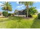 Large backyard with screened enclosure at 1149 Eureka Mill Run, The Villages, FL 32162