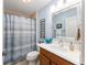 Clean bathroom with shower/tub combo, wood vanity, and updated fixtures at 1149 Eureka Mill Run, The Villages, FL 32162