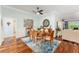 Elegant dining room with hardwood floors and a ceiling fan at 1149 Eureka Mill Run, The Villages, FL 32162