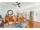 Spacious dining area with hardwood floors and a view to the kitchen at 1149 Eureka Mill Run, The Villages, FL 32162