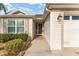 Home's exterior features a light beige facade and a walkway at 1149 Eureka Mill Run, The Villages, FL 32162