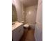 Clean bathroom with a white vanity, bathtub, and tile floor at 11550 Foxglove Dr, Clermont, FL 34711