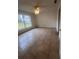 Spacious bedroom with tile flooring and backyard view at 11550 Foxglove Dr, Clermont, FL 34711