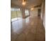 Spacious living area with tile flooring and sliding glass doors at 11550 Foxglove Dr, Clermont, FL 34711