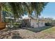 Landscaped backyard with a view of the house at 1209 Elysium Blvd, Mount Dora, FL 32757