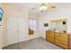 Bedroom with window seat, dresser, and ceiling fan at 1209 Elysium Blvd, Mount Dora, FL 32757