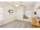 Bedroom with window seat, TV, and wooden dresser at 1209 Elysium Blvd, Mount Dora, FL 32757