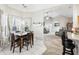 Casual dining area with table and chairs, view into living room at 1209 Elysium Blvd, Mount Dora, FL 32757