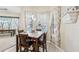 Kitchen nook with a marble table and pool view at 1209 Elysium Blvd, Mount Dora, FL 32757