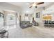 Living room with gray sofas and high ceilings, open to kitchen area at 1209 Elysium Blvd, Mount Dora, FL 32757