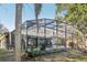 Screened pool and house exterior view at 1209 Elysium Blvd, Mount Dora, FL 32757